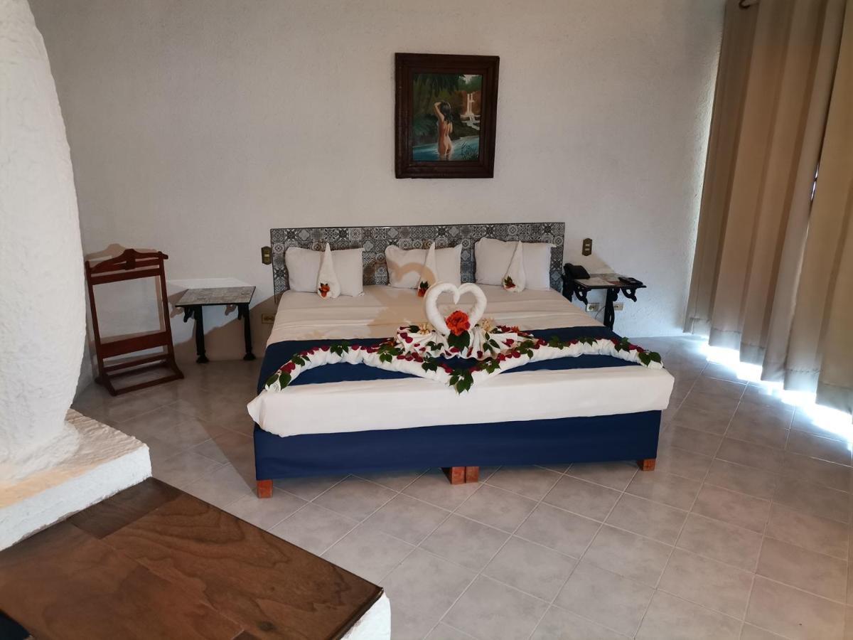 哈深达德拉诺里亚大酒店 阿瓜斯卡达特斯 外观 照片 A bedroom at the hotel