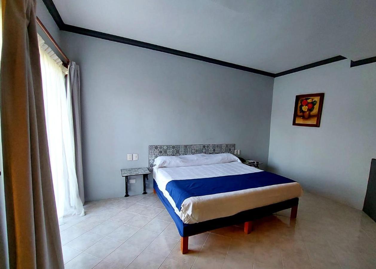 哈深达德拉诺里亚大酒店 阿瓜斯卡达特斯 外观 照片 A bedroom at the hotel