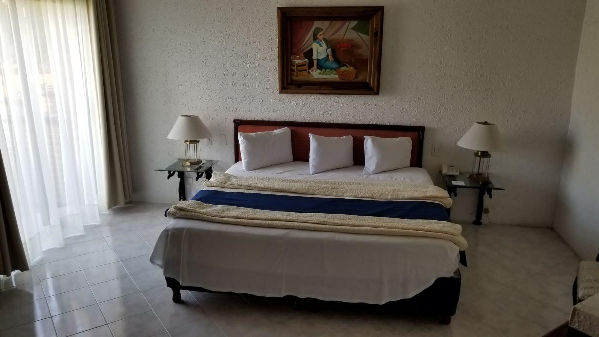 哈深达德拉诺里亚大酒店 阿瓜斯卡达特斯 外观 照片 A bedroom at the hotel